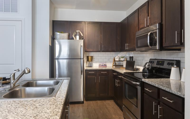 a kitchen with black appliances