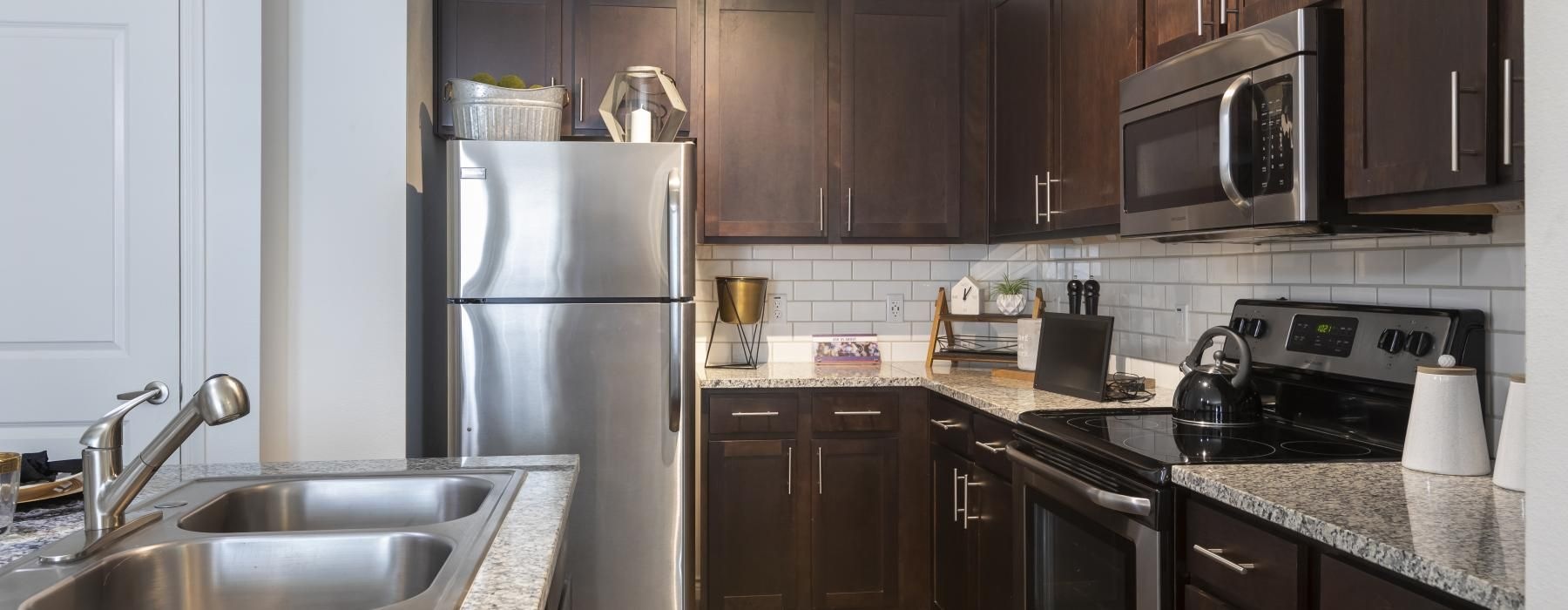 a kitchen with black appliances